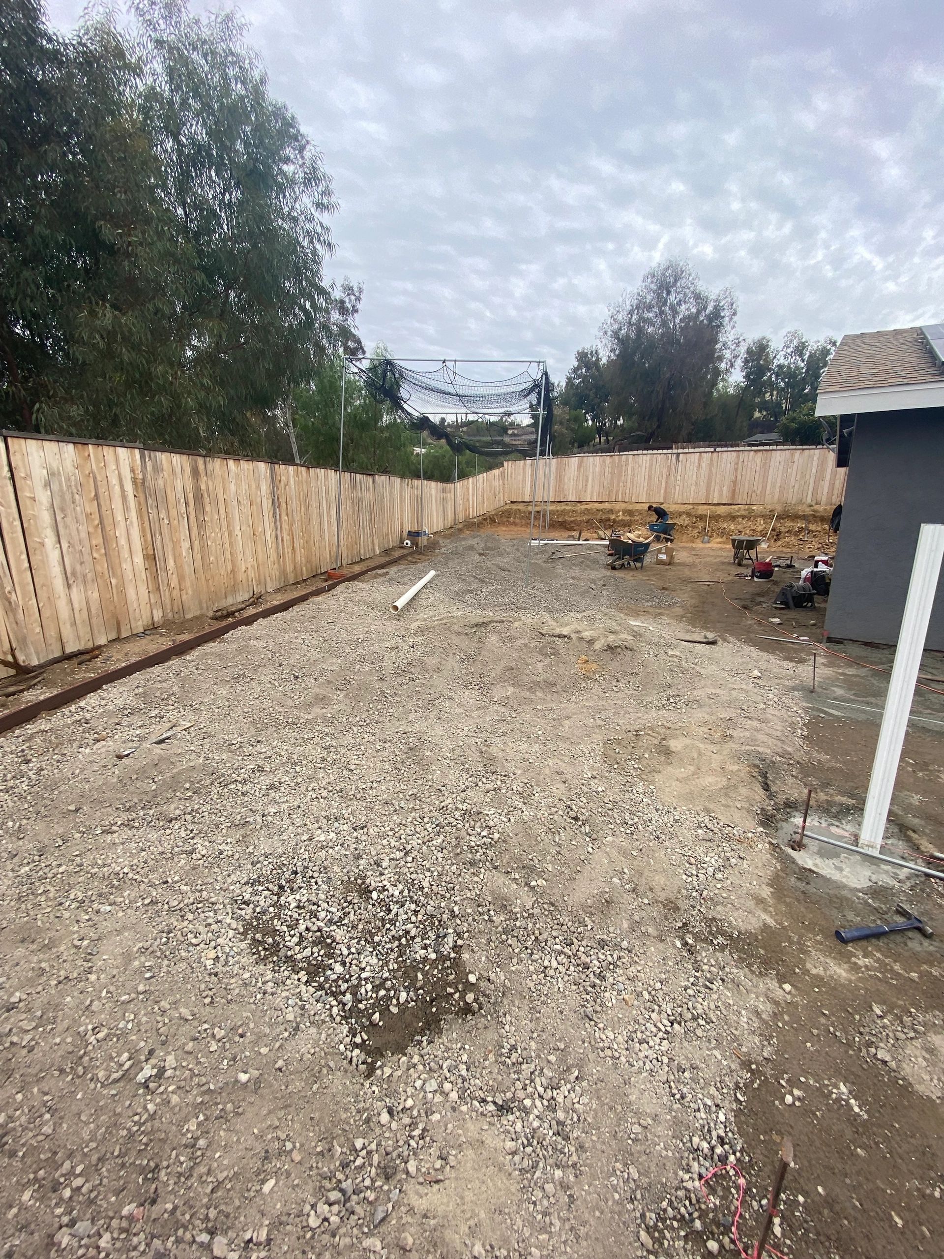 Backyard before construction, bare dirt